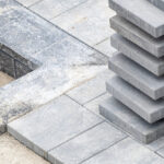 Stack,Of,Grey,Concrete,Patio,Stones,On,A,Patio,Construction