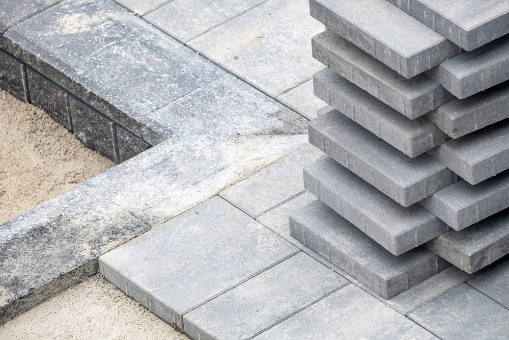 Stack,Of,Grey,Concrete,Patio,Stones,On,A,Patio,Construction